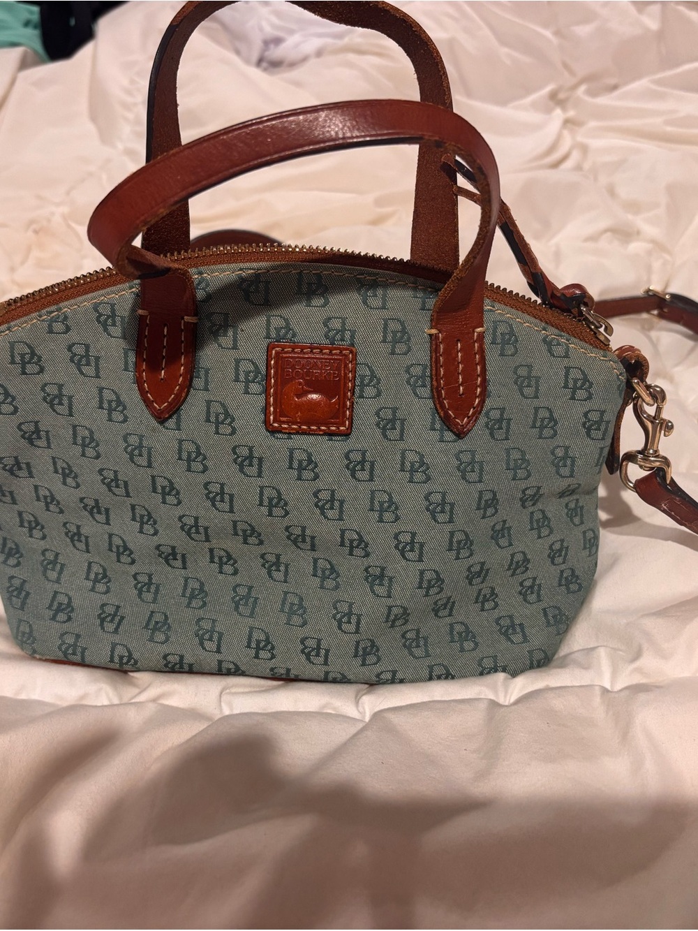 Dooney & Bourke Teal Logo Print Crossbody with Brown Leather Trim some wear